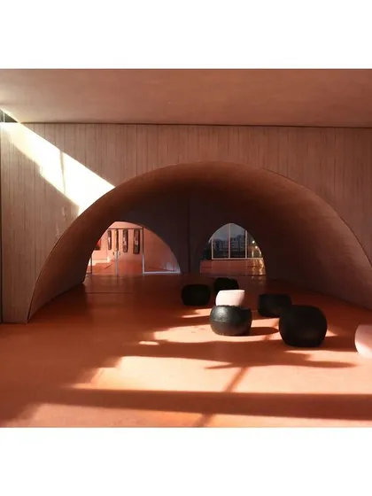 A model of an interior space with dramatic vaulted ceilings. The play of light and shadow in the model helps us understand how the final space will feel and how to shape the experience.