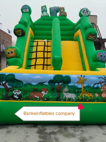 This is our jungle-themed bouncy slide. It features painted animals like tigers, monkeys, and giraffes, with fun animal heads at the top. It's a great choice for an animal or safari-themed event.