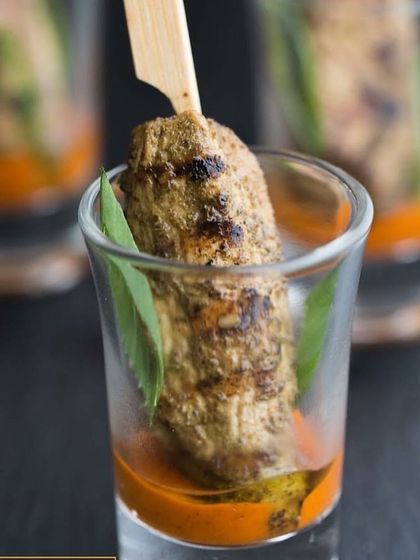 Here is my chicken malai tikka served in a shot glass with a tangy dipping sauce. This modern presentation of a classic Indian kebab is always a conversation starter at events.