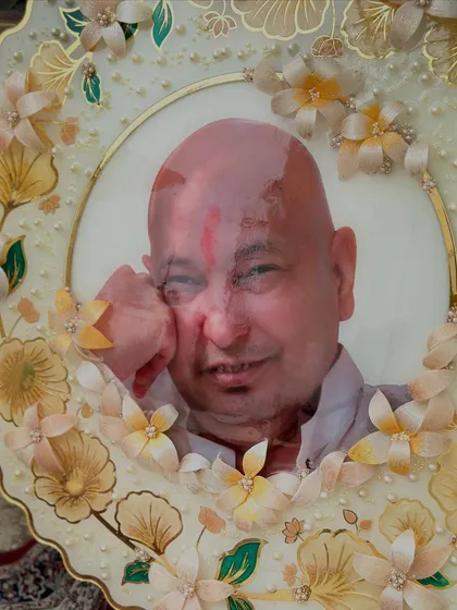 A close-up of the finished Guruji frame, showing the detail in the handcrafted 3D resin flowers and the serene expression of Guruji.