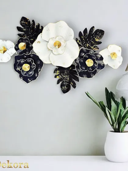We created this floral metal art piece for those who love classic color palettes. The high-contrast design in black, white, and gold offers a timeless elegance, making it a versatile sculpture for various interior styles.