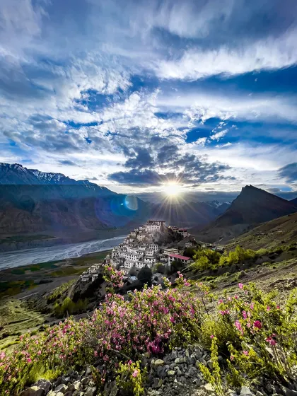 The sun rises over the iconic Key Monastery in Spiti Valley, Himachal Pradesh. Capturing this view shows the scale and serenity of the Himalayas, a place where spirituality is carved into the landscape itself.