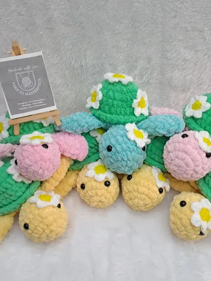 A whole family of my handmade daisy turtles, showing the different color combinations available. They make a wonderful, colorful collection.