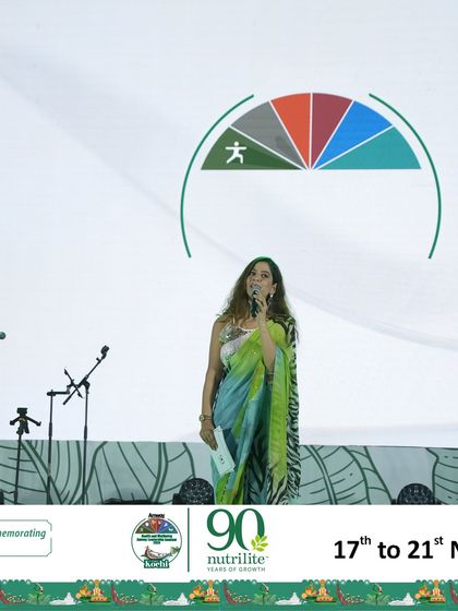 On the large stage at the Amway Health and Wellbeing Leadership Seminar.