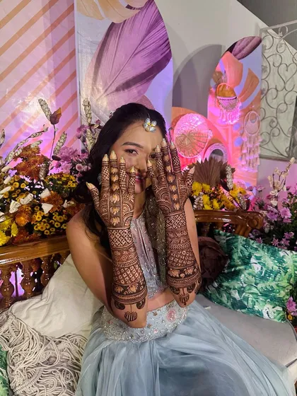 This client's playful personality shines through as she shows off her detailed and festive party mehndi.