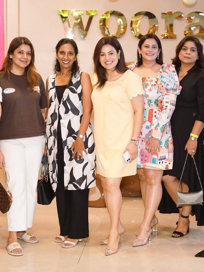A group of mothers gathered for a photo, all smiles during the celebration. We love seeing parents enjoy the party as much as their children.