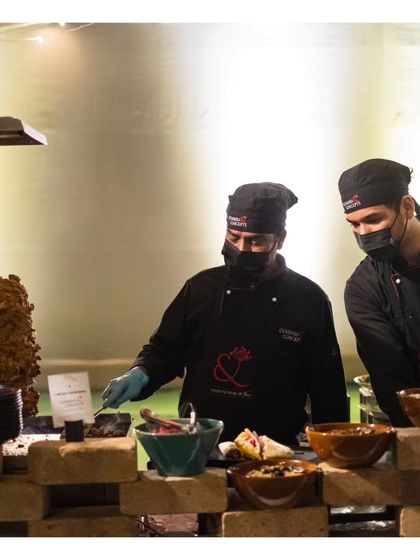 Our chefs at a live shawarma station, carving meat from a vertical rotisserie. This is another example of the authentic, global street food experiences we can bring to your event.