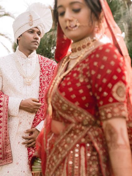 A moment of quiet connection between Aman and Saniya. The groom's gaze on his bride, who is slightly out of focus, creates a sense of depth and anticipation.