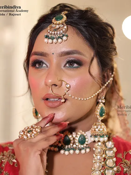 This close-up highlights the subtle green liner on the lower lash line, a technique to tie the eye makeup in with the outfit's color scheme.