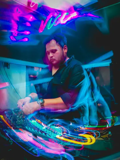 In the zone, surrounded by light and sound. This is where I blend tracks, mixing EDM, Bollywood, and Hip Hop to create a unique soundtrack for the night.