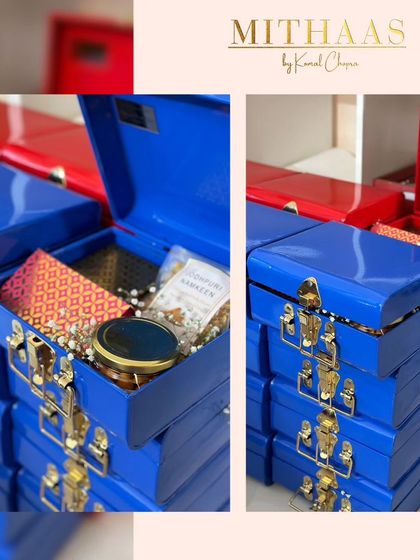 These vibrant metal trunks in royal blue and festive red are perfect for creating budget-friendly yet luxurious hampers. Their sturdy build and classic design make them a gift that lasts long after the treats are gone.