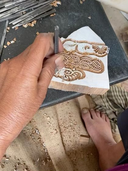 The hands of a master carver, using tools passed down through generations to shape a new design. Every chip and line is made with intention, turning a simple piece of wood into a tool for creating timeless art.