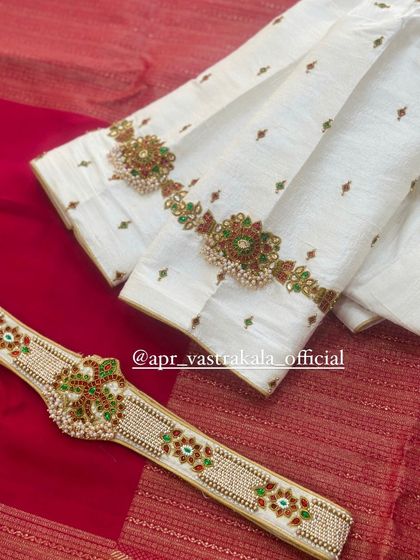 Another view of the off-white blouse and belt set.