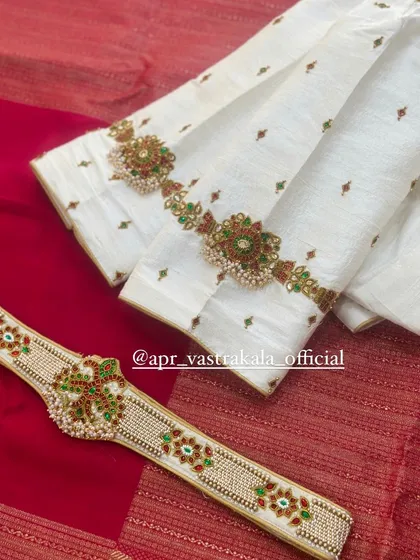 A closer look at the sleeve and belt, highlighting the detailed floral motifs crafted with kemp stones.