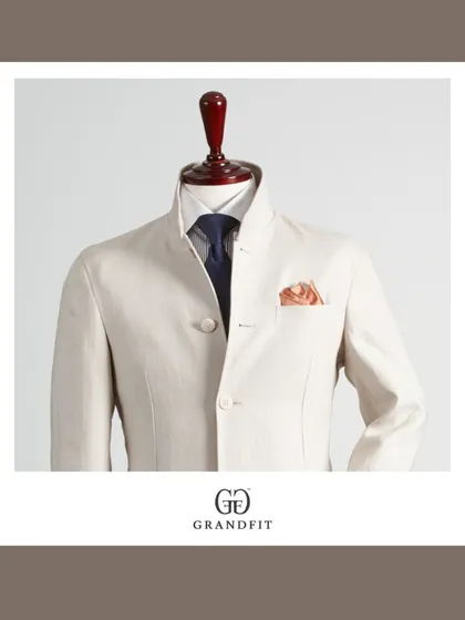 A detailed view of the mandarin collar and precise button placement on our custom Bandhgala. Every element is meticulously considered to achieve a clean and polished finish in our tailored menswear.