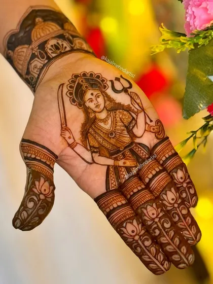 Another angle of the Dashama henna, showing the goddess with her trident and sword. This design is a powerful symbol of faith and protection.
