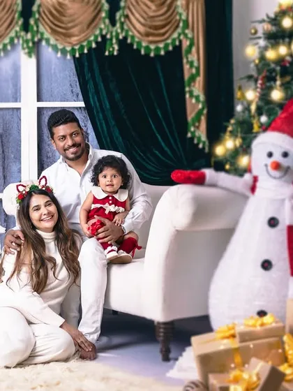 A heartwarming family portrait, perfectly capturing the joy and togetherness that defines the Christmas spirit.