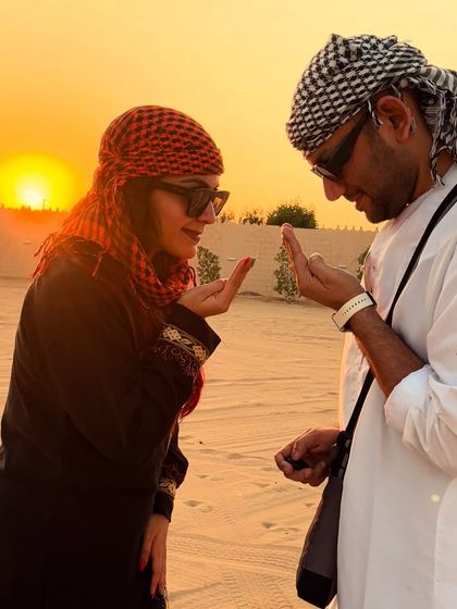 A playful moment in the Dubai desert. The golden hour light and the vast sand dunes made for a magical backdrop for our travel photos.