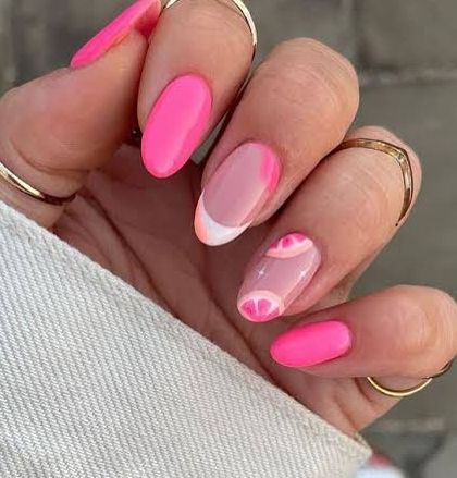 A bright and zesty summer design. This set features a vibrant pink polish with fun, citrus-slice accent nails for a playful and refreshing look.