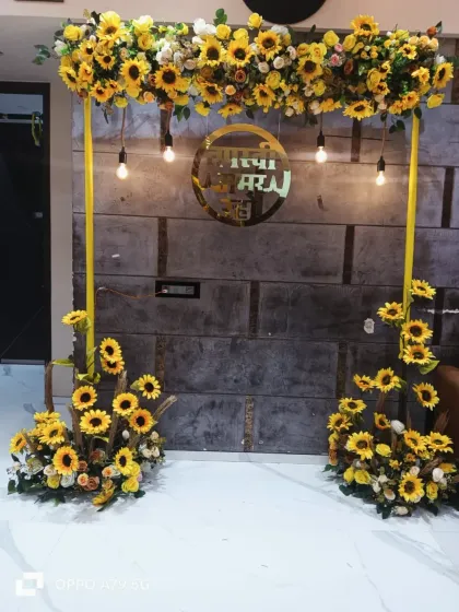 A bright and cheerful haldi or wedding backdrop. I used a full arch of sunflowers and a custom gold acrylic sign in Marathi that reads "शुभ विवाह" (Happy Wedding) to add a personal, local touch.