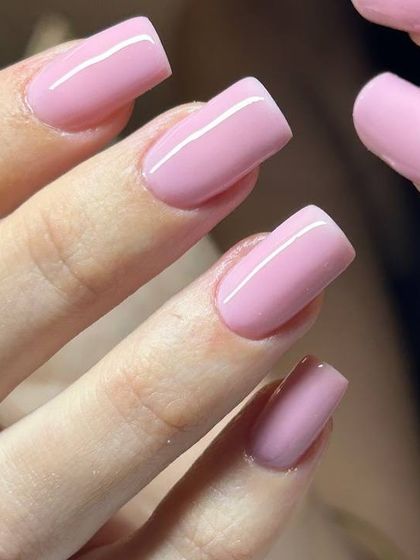 A soft, baby pink manicure on square-shaped nails. This classic, feminine color is always a beautiful choice.