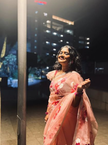 A candid shot from a wedding event. I'm comfortable in festive environments and love interacting with guests.