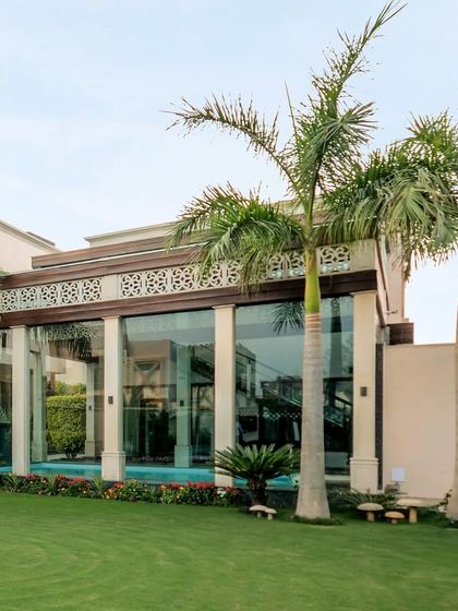 A grand entrance unfolds into a haven of serenity. This glasshouse contains a captivating pool and gym, crowned with a retractable louvre roof for a symphony of light, air, and elegance.