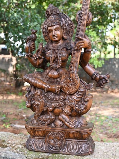 A 36-inch sculpture of Abhinaya Saraswathi, the goddess of knowledge and expressive arts. She is depicted holding a veena and accompanied by a small bird, symbolizing creativity.