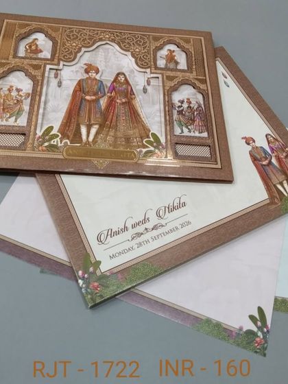 This card features a detailed illustration of a royal couple within a multi-layered, die-cut frame. The design creates a beautiful 3D effect, making your invitation stand out.