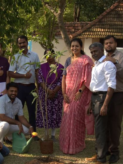 The team proudly poses with the newly planted Malabar Nut sapling. We believe in nurturing the earth just as it nurtures us.