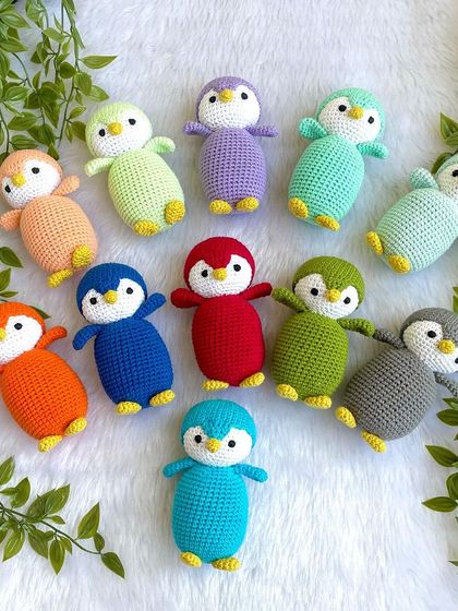 A rainbow of penguin babies! I made this colorful flock as return gifts for a birthday party. Each penguin is a different color, making them a unique and memorable party favor.