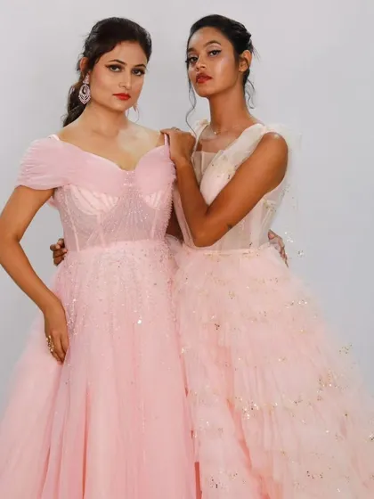 Two of my favorite pink gowns side-by-side. One features a classic off-shoulder design, while the other has a more modern, layered tulle look, showing the versatility of a princess silhouette.