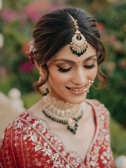 A close-up of the bride's makeup, showing the soft brown smokey eye and perfectly groomed brows. These are essential techniques for any bridal artist.