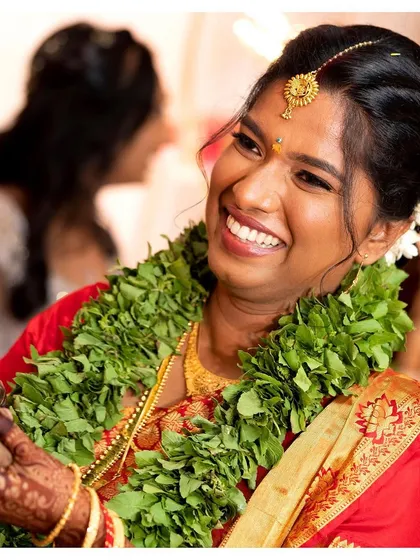 "You smile. And you make me smile." A candid, joyful moment from Jisha's wedding, her radiant look capturing the happiness of the day.