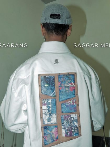 The back of the Prism Set overshirt, worn by Sarang. The contrasting patchwork adds an element of surprise, creating a fashion-forward ensemble for making a statement.