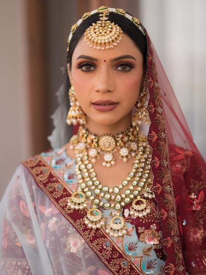 A direct look that captures the intensity of the maroon halo eye makeup. It’s a bold choice that paid off beautifully.