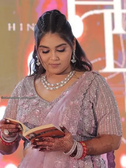 Even in a quiet moment, her sangeet makeup looks perfect. The soft glam style is versatile and beautiful for any part of the celebration.