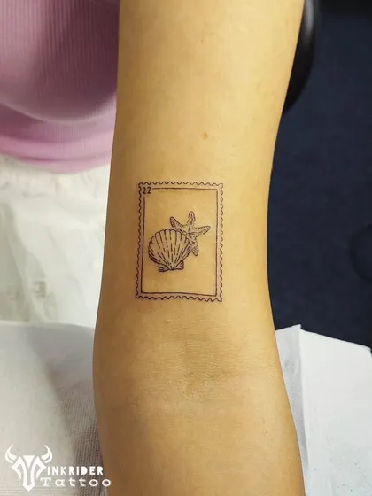 Another piece from our postage stamp series, this one featuring a seashell and starfish. It’s a perfect minimalist tattoo for lovers of the ocean.