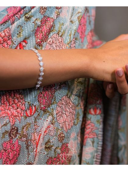 A detail shot of the printed georgette fabric, showcasing its delicate floral pattern and soft color palette.