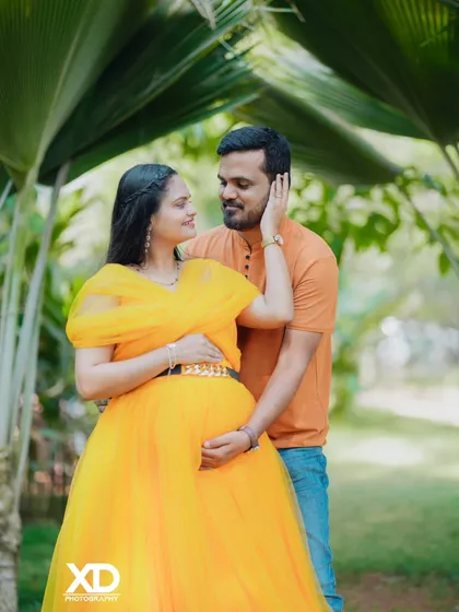 An intimate close-up of a couple in a garden, showing their loving connection.