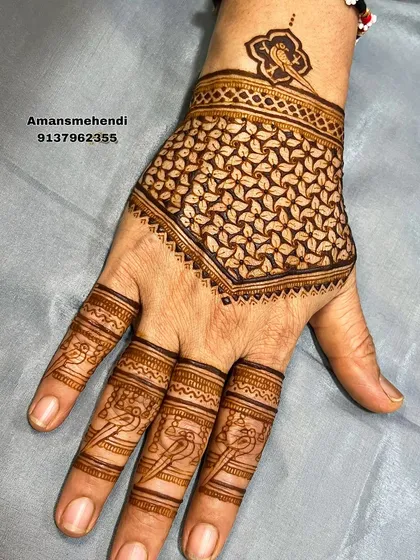 A clean and striking geometric design on the back of the hand, featuring a dense leaf-filled grid pattern that creates a beautiful texture.