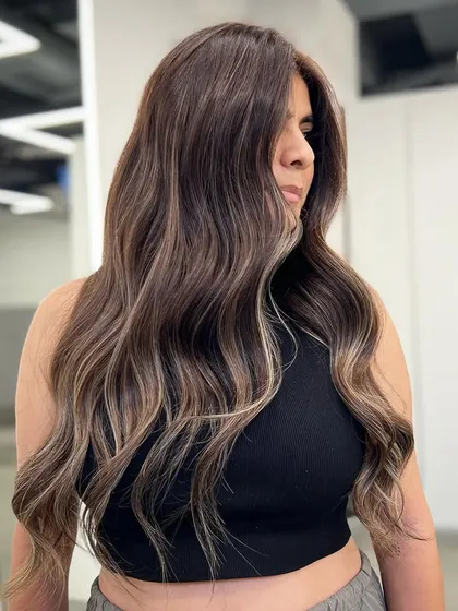 Another angle of this signature balayage, showcasing the beautiful blend of colors and the healthy shine of the hair.