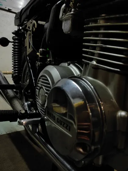 A close-up of the unique V-twin engine configuration of the Moto Guzzi 350 GTS.