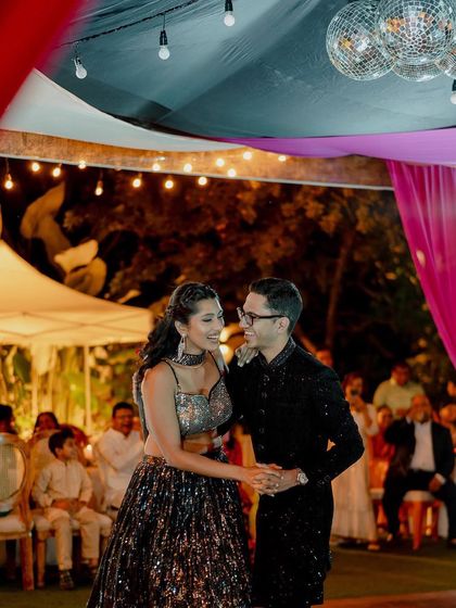 The perfect setting for a pre-wedding cocktail party or sangeet night. The lawn provides ample space for a dance floor, while the surrounding trees, lit with elegant chandeliers and string lights, create a festive and celebratory atmosphere.