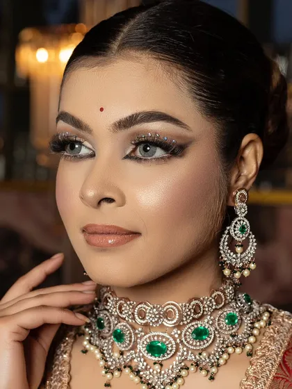 Embrace your unique beauty. This look features stones under the eyes for an extra touch of glam.