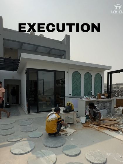 An "Execution" shot of a rooftop room under construction, with workers laying out the floor plan.