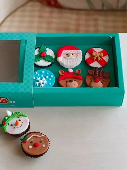 My Christmas cupcake collection is perfect for holiday parties or as a sweet gift. This box features six unique, handcrafted fondant toppers, including a snowman and a gingerbread man.