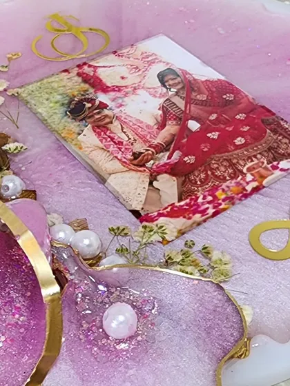 Work in progress on a resin frame for a newlywed couple. The pink resin and 3D flowers will create a beautiful setting for their photo.