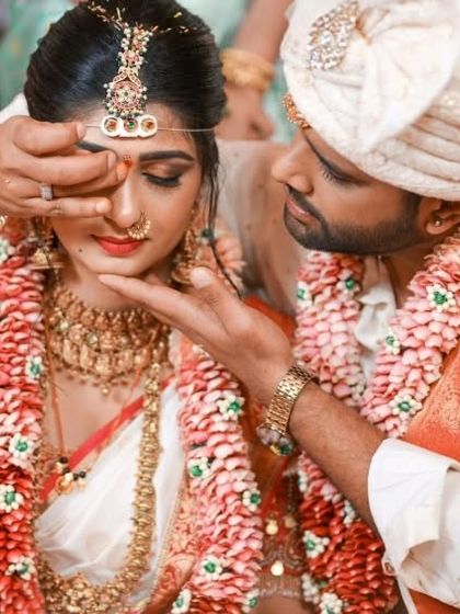 A beautiful, emotional moment from Aditi Prabhudeva's wedding. Her traditional South Indian bridal makeup looks flawless even in this candid shot, highlighting the importance of professional application.
