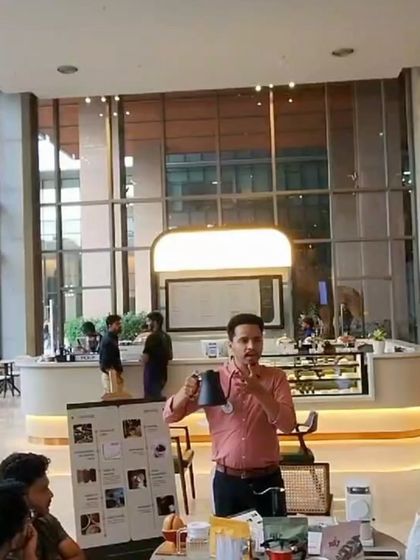 An instructor from Espresso Academy India leads a session at our Bellandur cafe, demonstrating brewing techniques to an attentive audience.